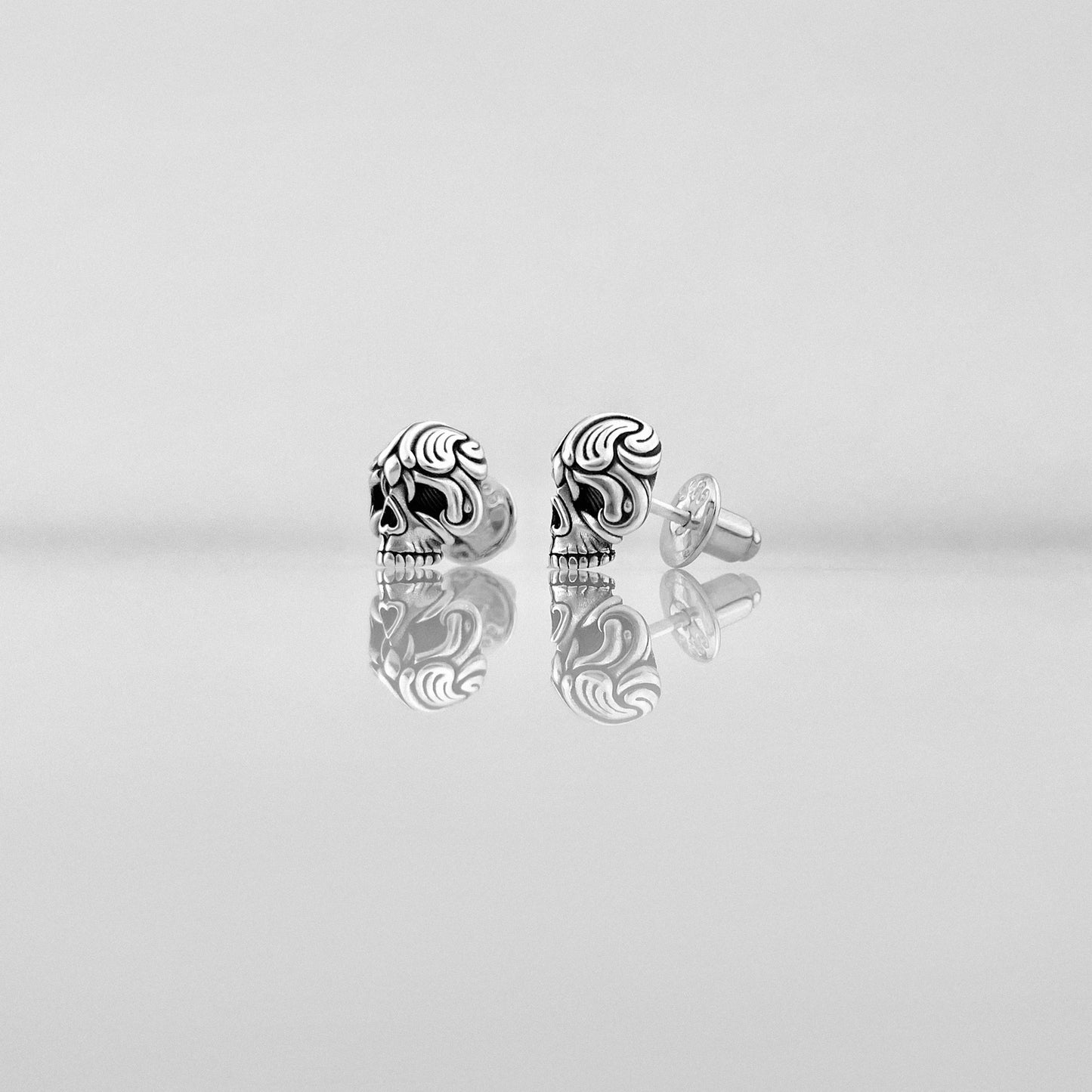 Small ornate silver Skull earrings