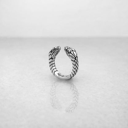 Edgy silver open ring with two snake heads