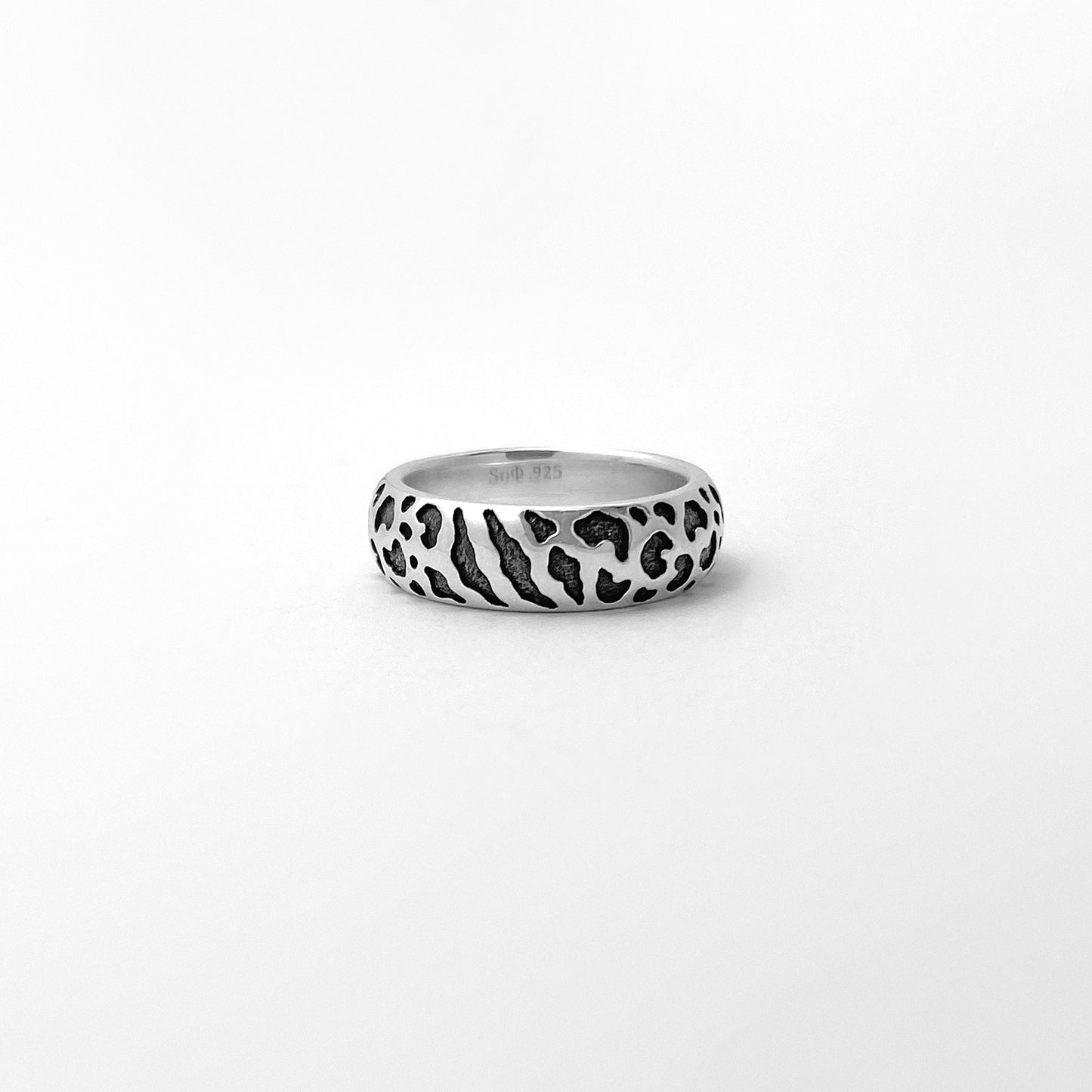 Silver ring with wild cat spots texture