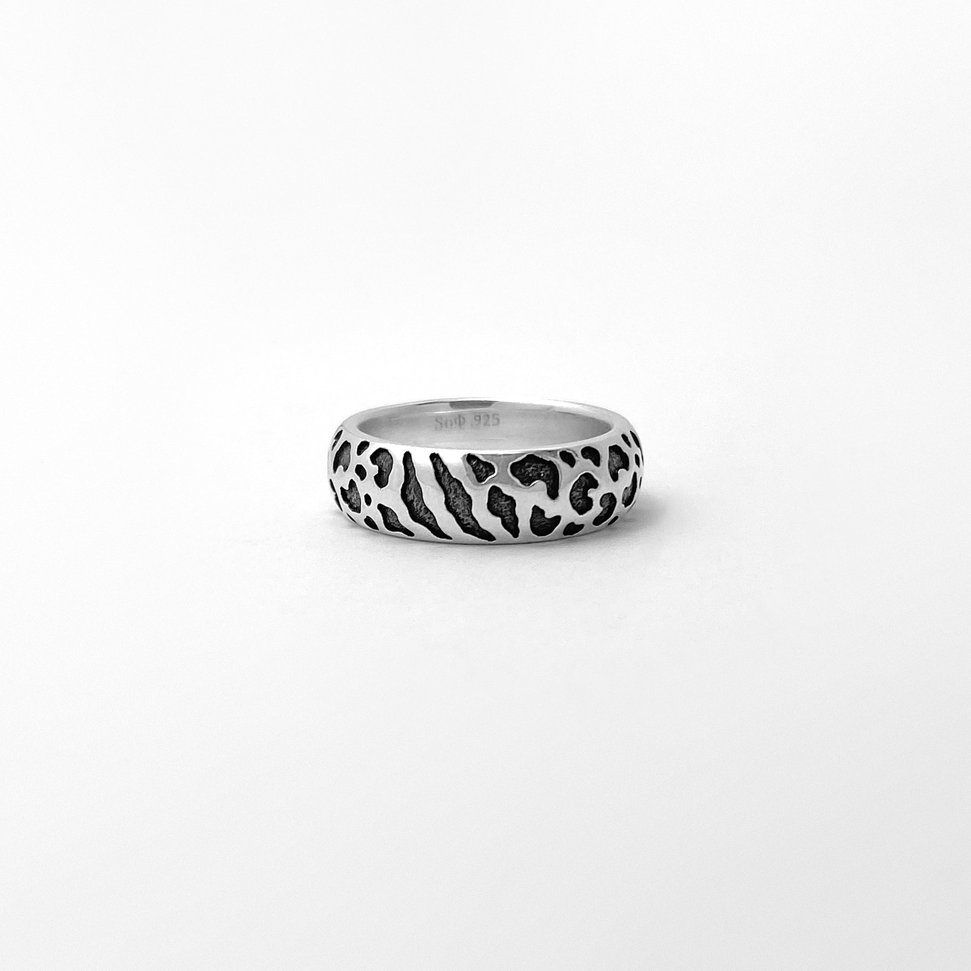 Silver ring with wild cat spots texture