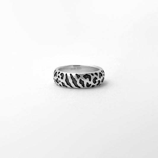 Silver ring with wild cat spots texture